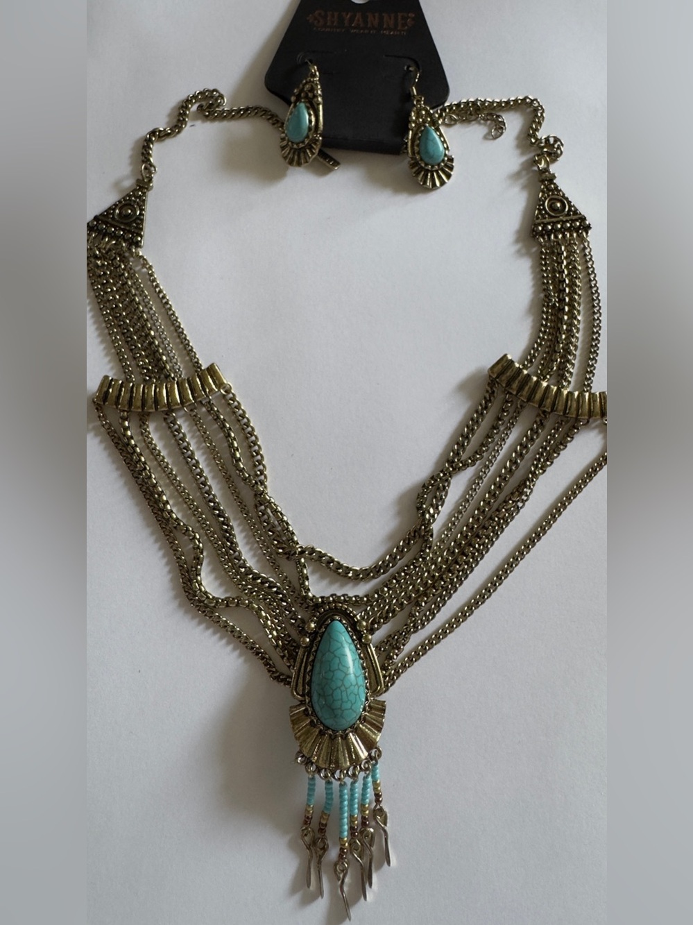 12” adjustable Shyanne Antique Gold Multi-Chain Necklace with Turquoise Teardrop